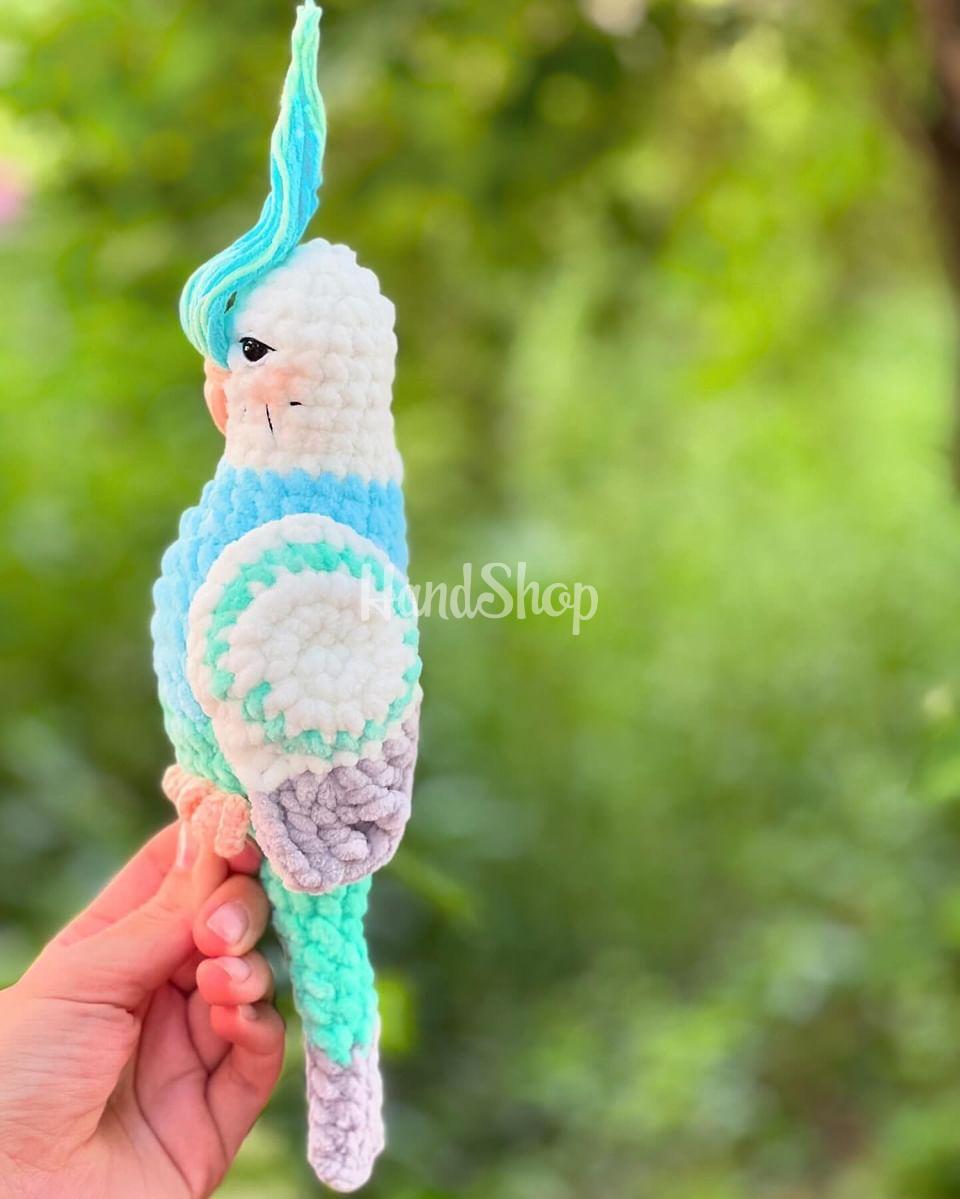 Авторська іграшка в’язаний папуга в бірюзово-білому кольорі Авторська іграшка в’язаний папуга в бірюзово-білому кольорі